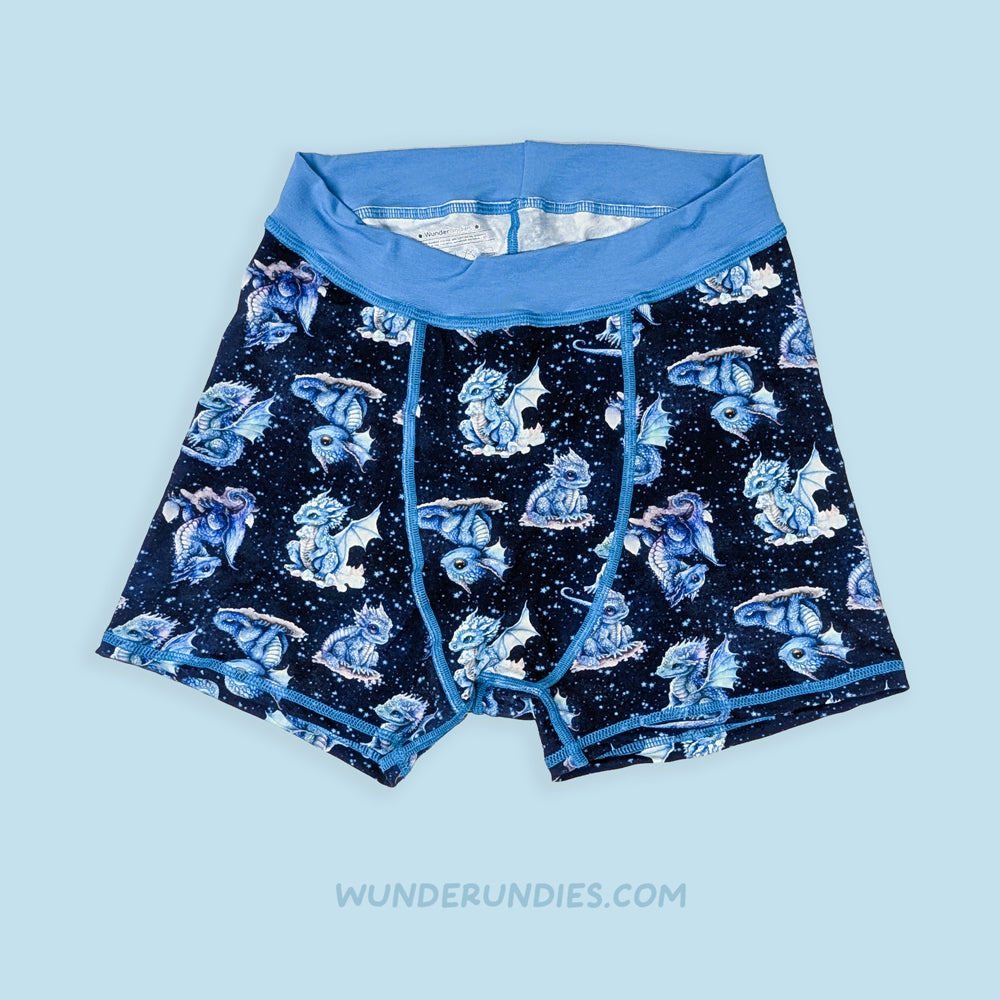 latex free dark blue boxer briefs with a pattern of dragons on a light blue background