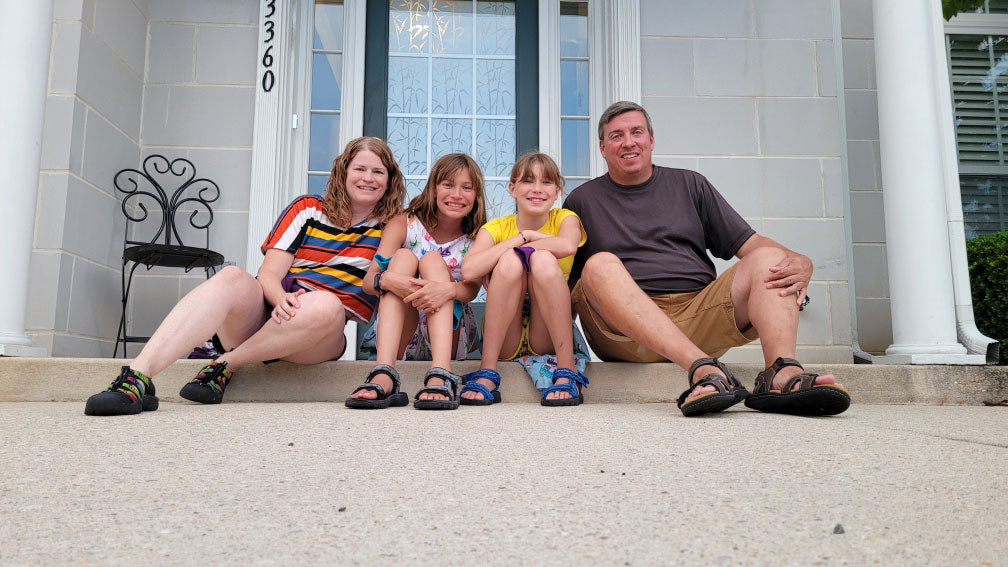 a family of four sitting on a door step - the founder of wunderundies