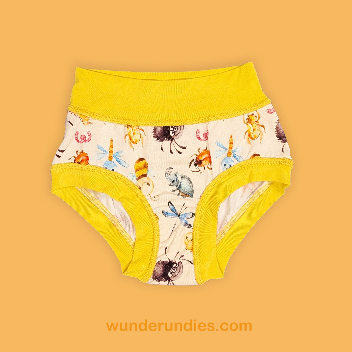 Children's underwear with a cute bug pattern and yellow trim on a beige background, featuring the brand 'wunderundies.com'.
