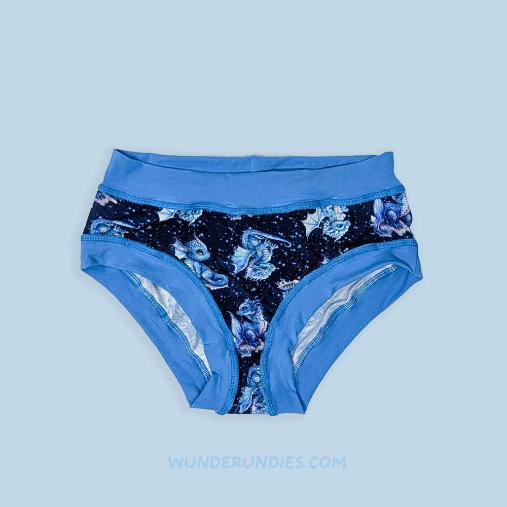 Blue women's sensory friendly underwear with dragon pattern on a light blue background