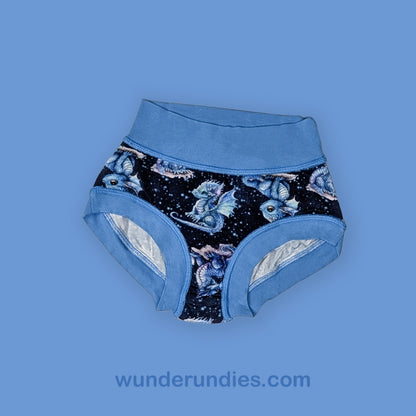 Blue children's underwear with fantasy dragon design on a blue background, featuring the brand 'wunderundies.com'.