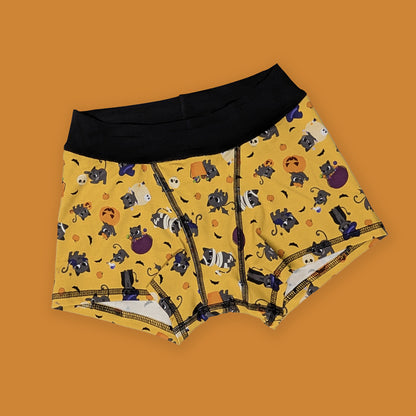 Yellow boxer briefs with Halloween-themed cat pattern on an orange background