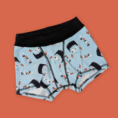 Boxer briefs with monster pattern on a solid background