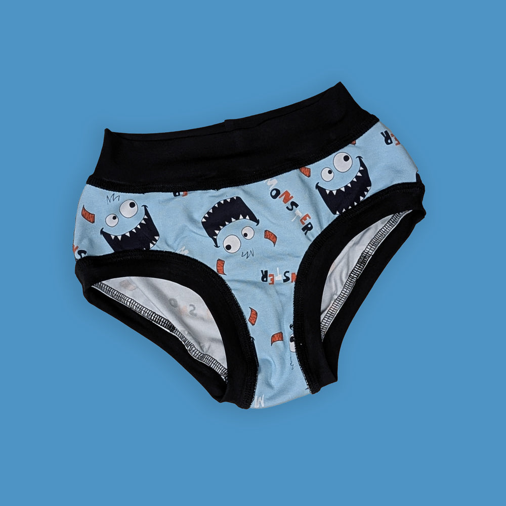 Children's underwear with monster pattern on a blue background
