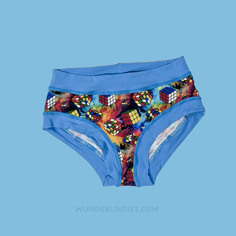 Blue sensory friendly underwear with Rubik's Cube pattern on a blue background