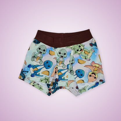 wunderundies boxers - elastic free underwear for kids - with a design of dinosaurs eating tacos on it