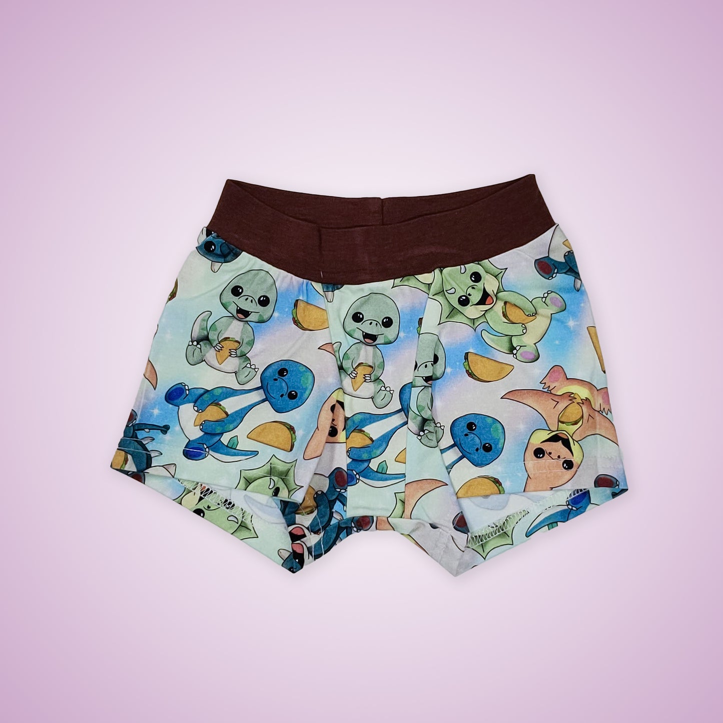 wunderundies boxers - sensory friendly underwear for kids - with a design of dinosaurs eating tacos on it