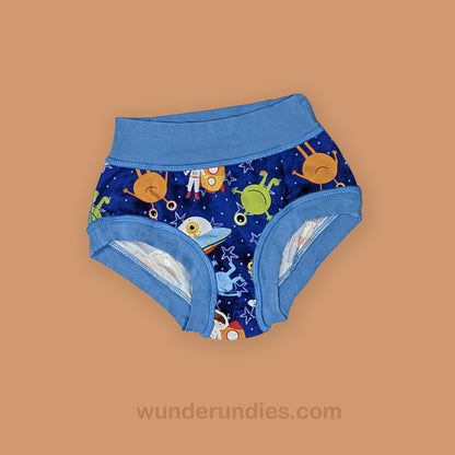 Children's sensory friendly underwear with space-themed design on a brown background
